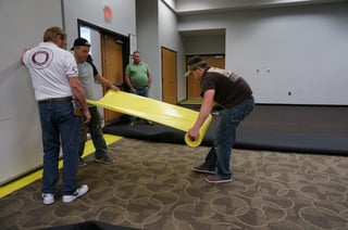 Lok-Lift is being put down over the existing carpet. 